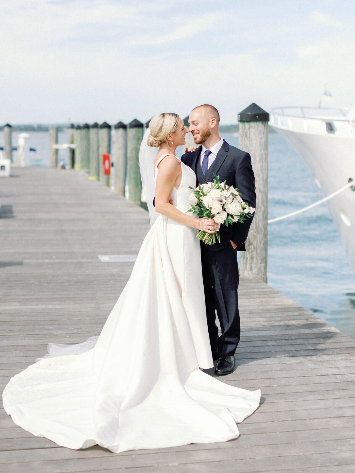 bride and groom on a dock