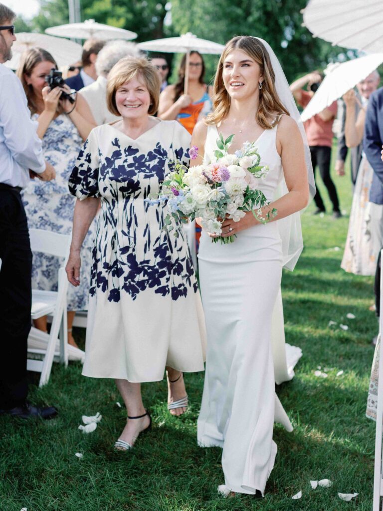 bride walked up the aisle by her mother
