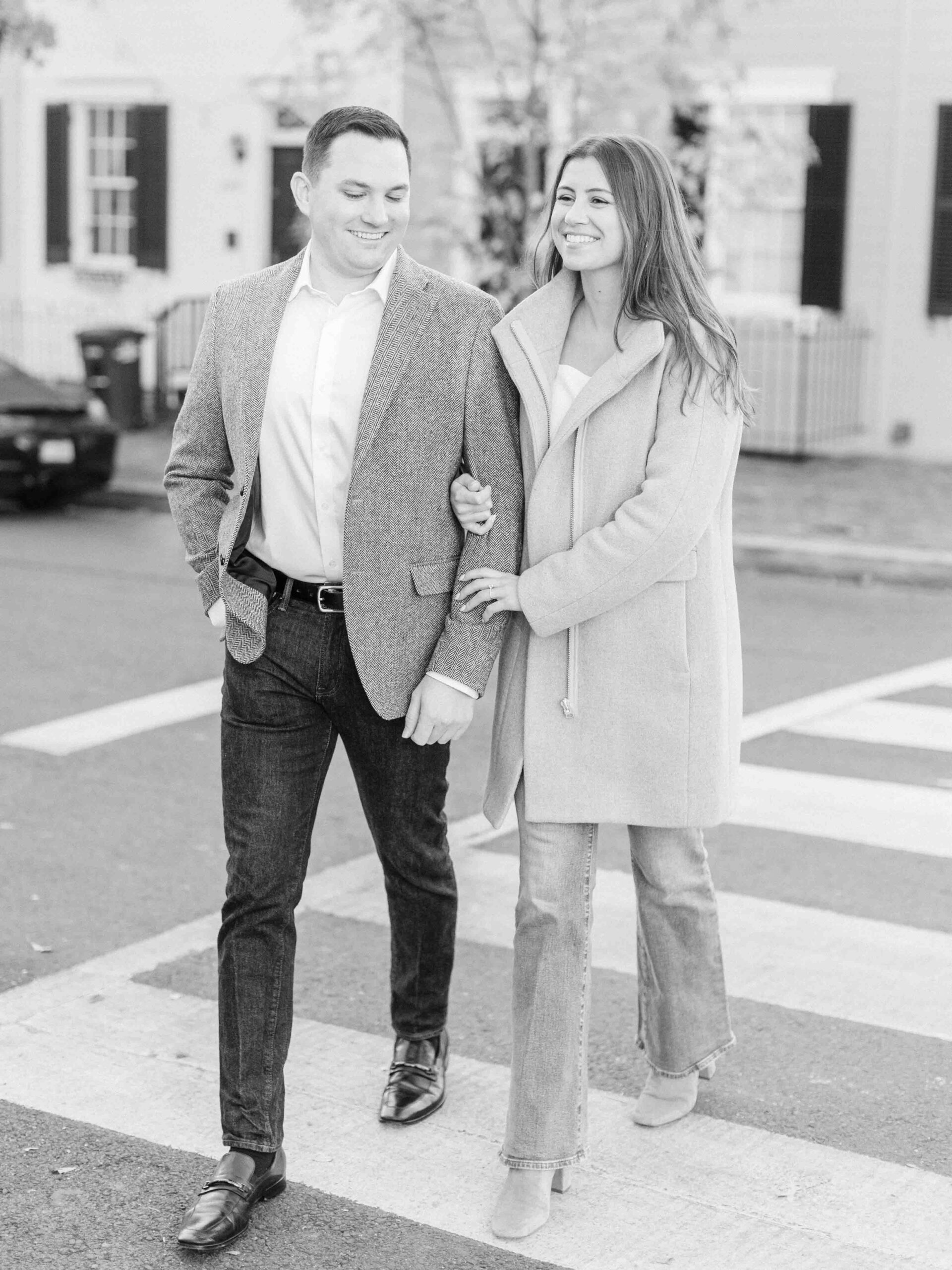 Couple walking around crossing the street in Georgetown in Washington DC